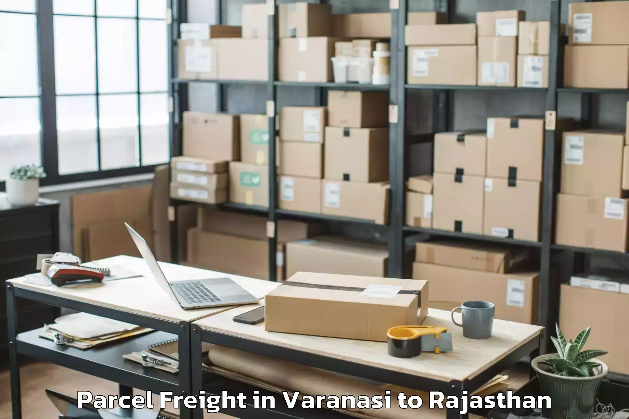 Book Varanasi to Padampur Parcel Freight